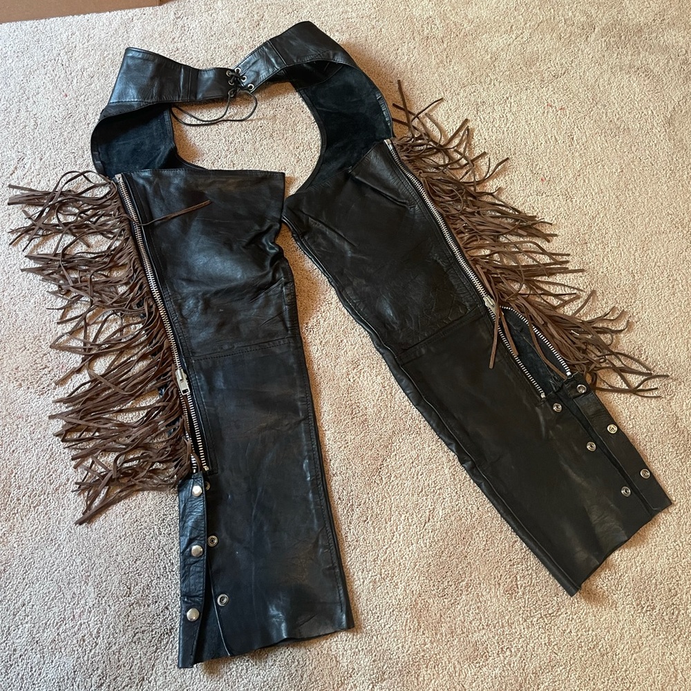 Black leather ladies chaps with brown fringe trim